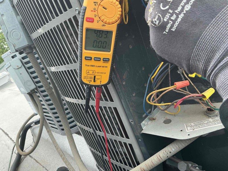 Completed comprehensive Comfort Plan clean and check service on 2.5-ton air conditioning system and air handler. Performed electrical diagnostics using digital multimeter, verifying voltage readings and system amperage draw at the outdoor condensing unit. Replaced 16x20x1 air filter at the air handler. Inspected condenser coil fins, tested all electrical connections, and confirmed proper system operation. All components operating within normal parameters with no deficiencies noted at time of service.
