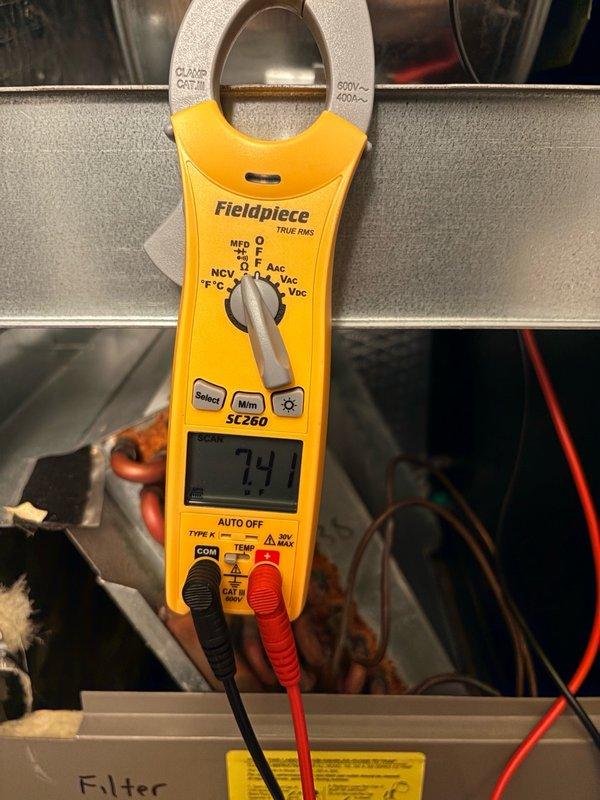 Completed preventive maintenance tune-up on single HVAC system. Inspected dual-run capacitor showing specifications of 35+5µF at 370VAC, confirmed proper electrical values, and verified compressor amperage reading of 7.4 amps using clamp meter. System operating within normal parameters; no filter replacement per customer request.