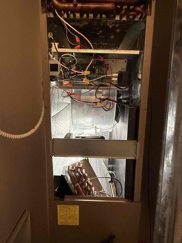 Completed comprehensive clean and check maintenance service on air conditioning and air handler system per Comfort Plan agreement. Performed electrical diagnostics using digital clamp meter, measuring voltage and amperage at outdoor condensing unit to verify proper system operation. Inspected indoor air handler cabinet, including evaporator coil assembly, electrical control boards, wiring connections, and heat exchanger components to ensure all systems functioning within manufacturer specifications.