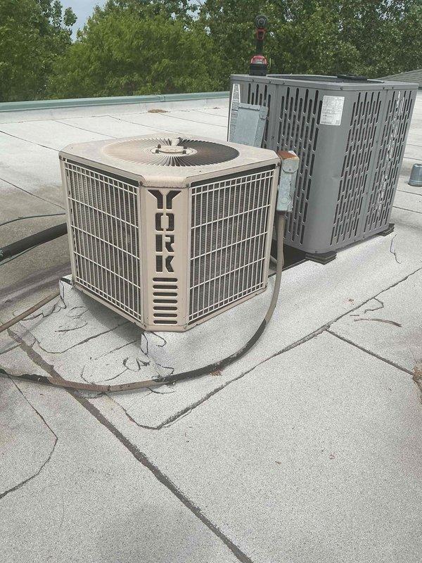 Performed comprehensive tune-up on rooftop-mounted York air conditioning system and air handler unit. Inspected blower wheel assembly and condenser unit, verified operational status of all components, and replaced air filter. System evaluated to determine if repairs are necessary before customer selects service plan option.