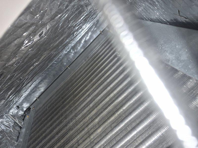 Performed comprehensive tune-up and maintenance on single HVAC system with property accessed via entry code. Conducted electrical diagnostics using clamp meter to verify system amperage and performance parameters. Inspected evaporator coil and surrounding insulation, confirming proper condition of heat exchanger fins and foil-faced insulation. Provided replacement filter as needed and documented system condition through photographic records.