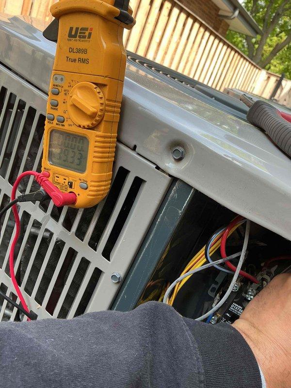 Completed spring clean and check maintenance service on two air conditioning systems per comfort plan agreement. Performed comprehensive system diagnostics using digital multimeter to verify electrical components, tested voltage and amperage readings at outdoor unit, inspected control boards and wiring connections, cleaned condenser coils, and verified proper thermostat operation with heat and cool setpoints configured at 67°F and 75°F respectively.