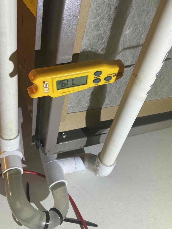 Completed comprehensive tune-up and maintenance on single-system air conditioning unit with air handler. Performed clean and check procedures on both indoor and outdoor components, replaced air filter, and verified system operation with diagnostic testing. Electrical measurements confirmed proper amperage draw at 39.7 amps, condensate drainage system inspected and found operational, and all refrigerant lines and connections verified secure with no leaks detected.
