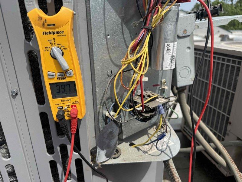 Completed comprehensive tune-up and maintenance on single-system air conditioning unit with air handler. Performed clean and check procedures on both indoor and outdoor components, replaced air filter, and verified system operation with diagnostic testing. Electrical measurements confirmed proper amperage draw at 39.7 amps, condensate drainage system inspected and found operational, and all refrigerant lines and connections verified secure with no leaks detected.
