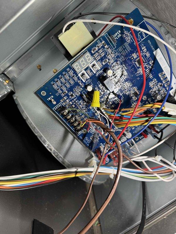 # New Thermostat Wire Installation

Installed new thermostat wire to HVAC system control board, establishing proper connections for improved system communication and control. Accessed main control board within equipment enclosure, terminated multi-conductor thermostat cable to appropriate terminals, and verified all wire connections for proper system operation.