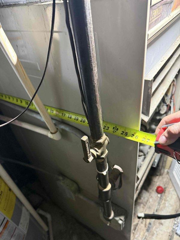 Responded to no cooling complaint on Amana air conditioning system. Upon arrival, verified thermostat settings and confirmed unit was not producing cold air. Performed visual inspection of outdoor condenser unit and indoor refrigerant line connections. Measured refrigerant line spacing and documented equipment specifications. Checked electrical connections, breaker status, and air filter condition. Conducted diagnostic assessment of condenser components including fan motor operation and coil condition. Photographed equipment nameplate data and refrigerant line configuration for service records. System evaluated and measurements taken to determine proper repair recommendations.
