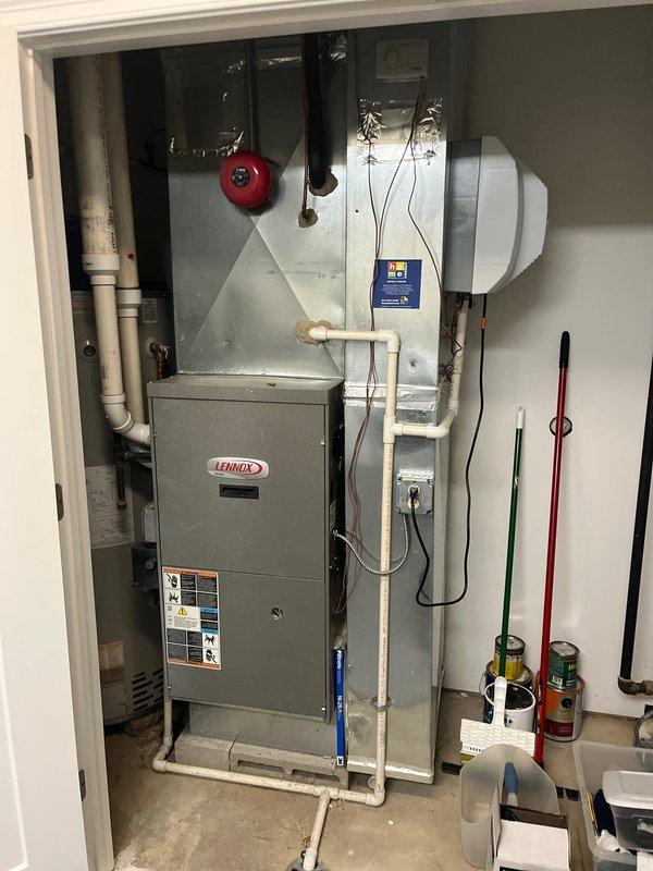 Completed estimate for replacement of two air conditioning units serving the first floor. System evaluation revealed low refrigerant levels indicating potential leak or compressor failure in existing equipment. Assessed existing Lennox furnace and HVAC infrastructure in basement mechanical room, documenting current system configuration including copper refrigerant lines, PVC condensate drainage, and ductwork connections. Provided comprehensive replacement estimate per customer request for dual AC unit installation to restore proper cooling capacity to affected zones.