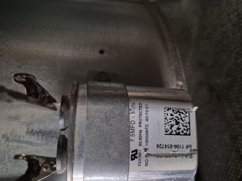 Replaced failed blower motor capacitor on first floor HVAC unit and recharged system with refrigerant to achieve proper subcooling levels. System tested and verified operational with thermostat responding correctly to temperature settings.