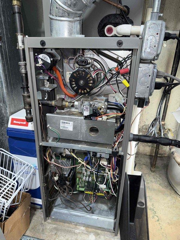 Completed comprehensive Clean and Check maintenance service on HVAC system per Comfort Plan agreement. Performed thorough inspection of furnace unit including blower motor assembly, gas valve components, control board, electrical connections, and refrigerant lines. All components found operating within normal parameters, temperatures verified with infrared thermometer, and unit returned to service in proper working condition.