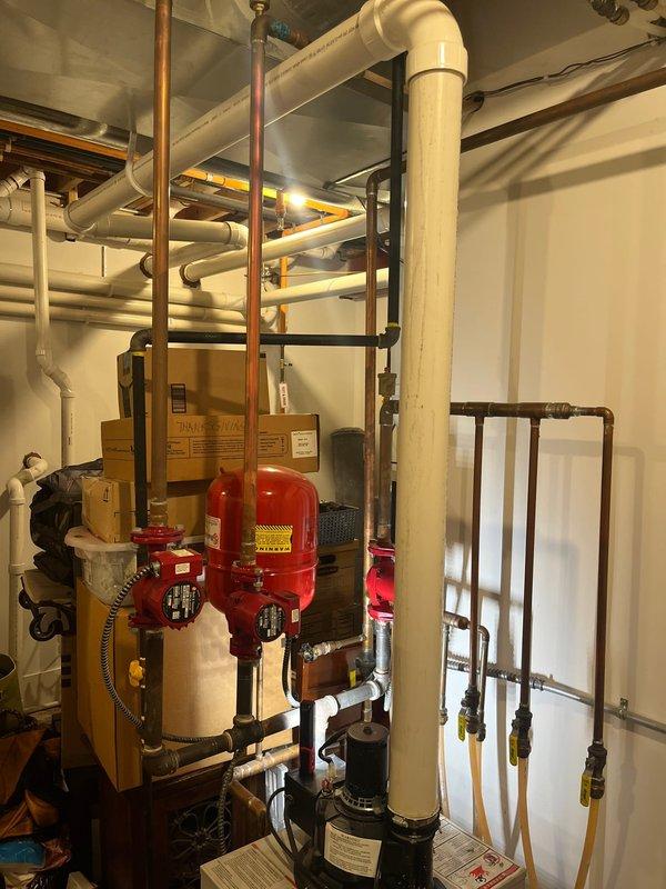 Completed high-efficiency boiler replacement with new expansion tanks, circulator pumps, and associated piping modifications. Replaced pressure switch on power vent system to restore proper boiler operation and collected final payment for estimate.