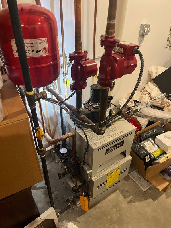 Completed high-efficiency boiler replacement with new expansion tanks, circulator pumps, and associated piping modifications. Replaced pressure switch on power vent system to restore proper boiler operation and collected final payment for estimate.