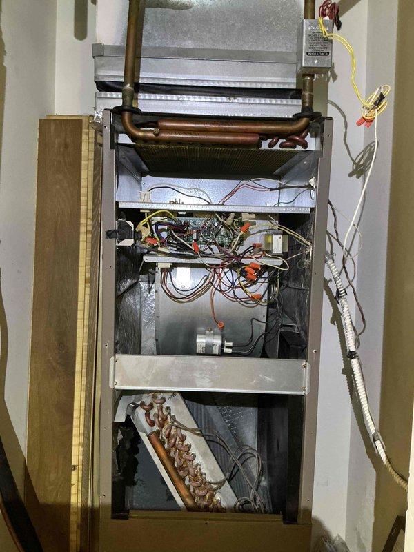 Completed comprehensive clean and check maintenance service on single HVAC system, including air conditioning unit and air handler. Performed standard maintenance procedures, inspected all internal components including heat exchanger, blower motor, refrigeration coils, and electrical connections, verified system operations with digital temperature readings showing 50.8°F at exterior condenser unit, and installed new 12x20x1 air filter. All components found operational with normal wear; system returned to full service.