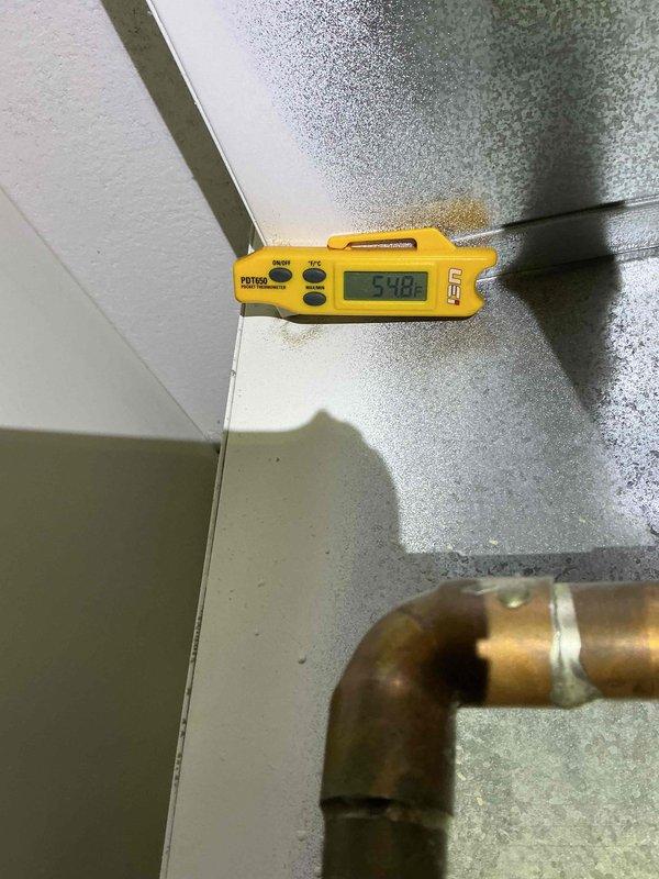 Completed comprehensive clean and check maintenance service on single HVAC system, including air conditioning unit and air handler. Performed standard maintenance procedures, inspected all internal components including heat exchanger, blower motor, refrigeration coils, and electrical connections, verified system operations with digital temperature readings showing 50.8°F at exterior condenser unit, and installed new 12x20x1 air filter. All components found operational with normal wear; system returned to full service.