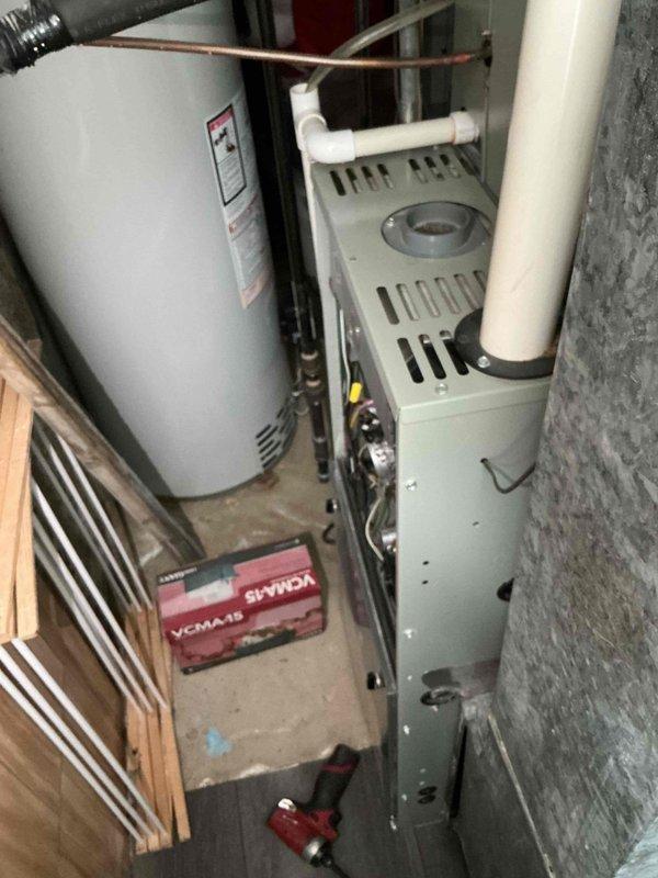 Responded to service call for furnace exhaust motor replacement. Upon arrival, performed diagnostic inspection of the furnace system and confirmed the exhaust motor required replacement. Accessed the blower compartment, documented existing equipment configuration with photos, and verified all electrical connections and wiring to the motor assembly. Inspected the blower housing, pressure switches, and associated ductwork for proper operation. Discussed repair options with customer and entered complete equipment information into service records for future reference.