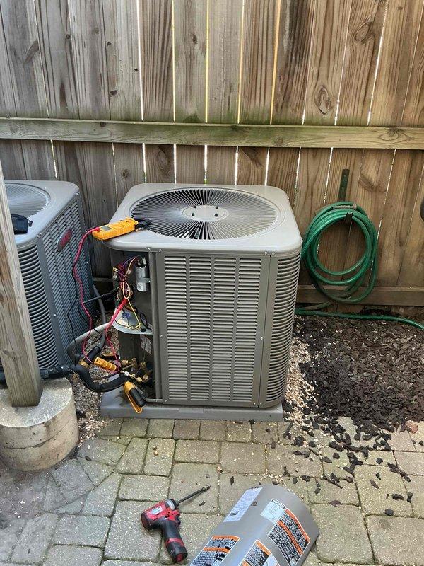 Responded to warranty call regarding loud clicking noise during startup on recently installed air conditioning system. Performed diagnostic testing on both outdoor condensing units, removed access panels to inspect internal components including contactors, capacitors, and electrical connections. Verified proper operation of all systems and addressed startup issue to ensure units are functioning within manufacturer specifications.