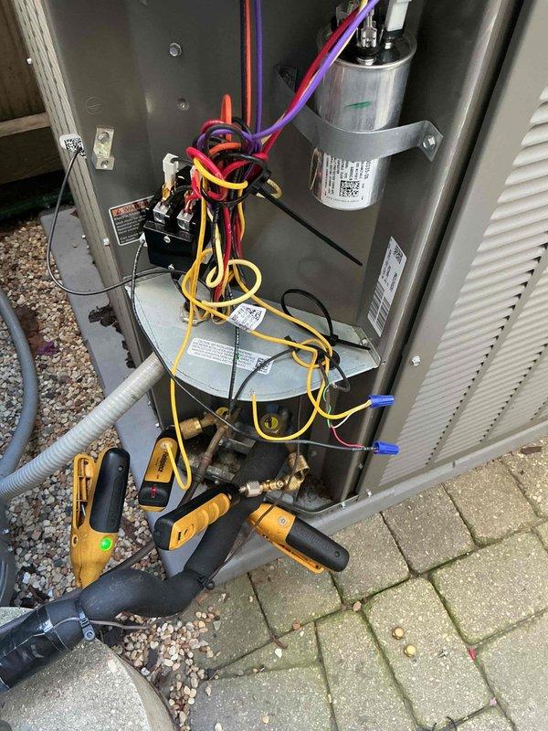 Responded to warranty call regarding loud clicking noise during startup on recently installed air conditioning system. Performed diagnostic testing on both outdoor condensing units, removed access panels to inspect internal components including contactors, capacitors, and electrical connections. Verified proper operation of all systems and addressed startup issue to ensure units are functioning within manufacturer specifications.