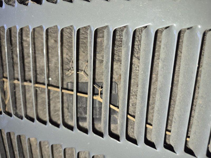 Completed spring clean and check service on air conditioning system per comfort plan maintenance agreement. Performed comprehensive inspection of all system components, cleaned heavily soiled supply and return air grilles with significant dust and debris accumulation, and verified proper operation of outdoor condensing unit with visible dirt buildup on exterior louvers and coil surfaces.
