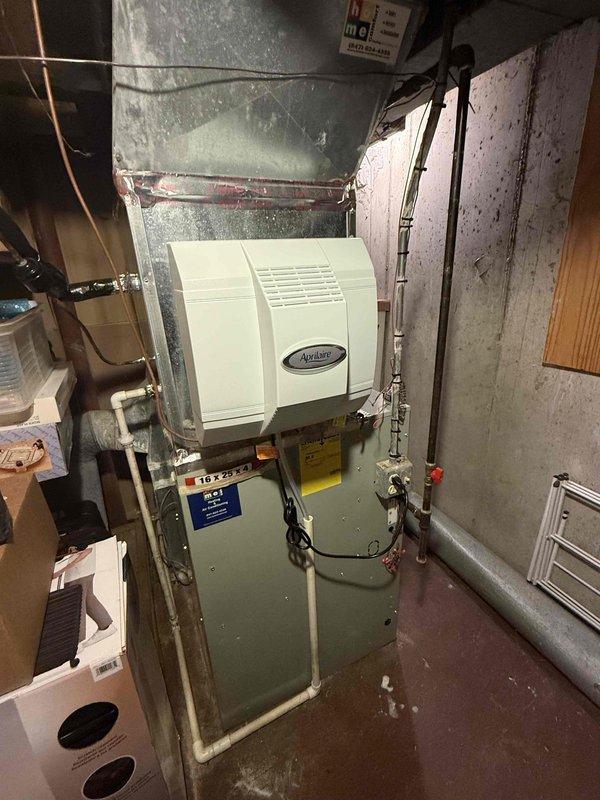 Completed scheduled Comfort Plan clean and check maintenance on single HVAC system per service contract protocol. Performed comprehensive inspection of air handler and humidification equipment located in basement utility area. Verified proper operation of all system components, inspected electrical connections and control wiring for secure routing and strain relief integrity, and documented equipment condition with photographic records. System found operating within normal parameters with no immediate service needs identified.