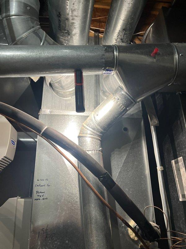 Responded to first-floor air conditioning system operating with low refrigerant charge. Diagnosed 3.5-ton 2012 AC unit with 410a refrigerant level below specification and dual capacitor reading out of acceptable range. Based on system age, refrigerant loss, and failed capacitor, recommended complete system replacement rather than repair. Provided estimate for new air conditioning equipment installation. Unit currently marked as customer no contact per company protocol pending estimate approval.