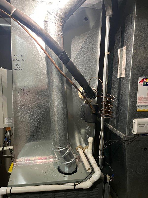 Responded to first-floor air conditioning system operating with low refrigerant charge. Diagnosed 3.5-ton 2012 AC unit with 410a refrigerant level below specification and dual capacitor reading out of acceptable range. Based on system age, refrigerant loss, and failed capacitor, recommended complete system replacement rather than repair. Provided estimate for new air conditioning equipment installation. Unit currently marked as customer no contact per company protocol pending estimate approval.