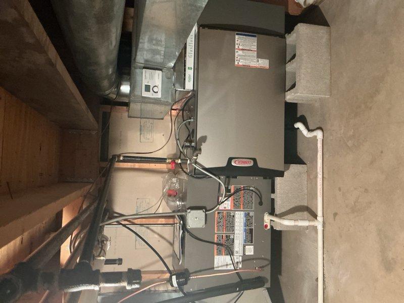 Completed full HVAC system replacement including removal and disposal of existing forced air furnace and air conditioning system. Installed new Lennox SLP99UH090XV36CK 99% efficiency 88,000 BTU gas furnace (Cat #26J91) with connections to existing supply/return ductwork, gas line, electrical circuit, and exhaust system with necessary sheet metal transitions. Reclaimed refrigerant from old AC system and installed new Lennox EL18KSLV-036 3-ton variable speed heat pump condenser (Cat #28V26) on leveled pad with pea gravel and new matching evaporator coil. Connected system to existing copper refrigerant lines, evacuated system to remove moisture and air, and charged with R454B refrigerant to manufacturer specifications. Performed complete system startup, testing, adjustment, and safety inspection on all equipment to verify proper operation of both heating and cooling systems.