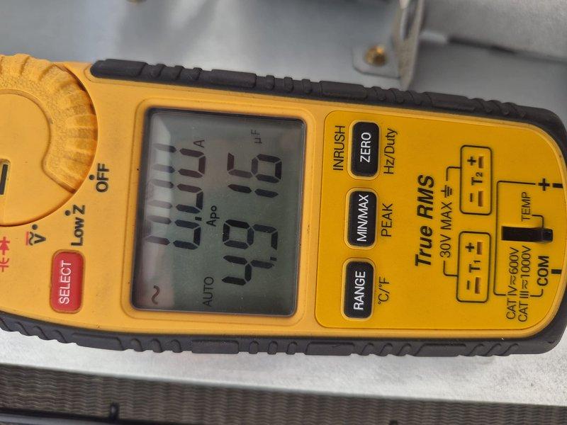 Completed comprehensive tune-up and inspection on air conditioning and air handler system. Verified system operation, tested capacitor functionality with multimeter showing proper readings, and confirmed all electrical components operating within specifications. Customer declined filter replacement at time of service.