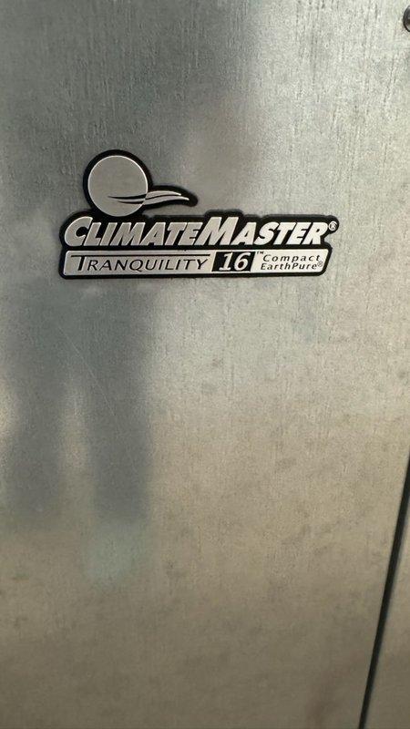 Responded to no cooling complaint on ClimateMaster Tranquility 16 Compact EarthPure geothermal heat pump system. Performed diagnostic evaluation of air handler unit and evaporator coil assembly, verified thermostat settings, inspected air filter condition, and confirmed electrical breaker status. Documented equipment model information and photographed system installation including refrigerant line connections, condensate drainage, and overall unit condition for service records.