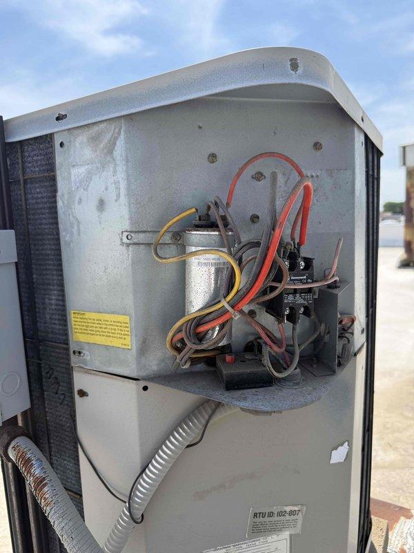 Responded to report of non-operational air conditioning system at commercial property with new tenants. Upon arrival, accessed rooftop unit RTU ID 102-807 and performed comprehensive system inspection. Verified electrical components including capacitor, contactor, and associated wiring connections. Conducted operational testing to assess system functionality following building vacancy period. Unit evaluated and confirmed ready for cooling season operation.