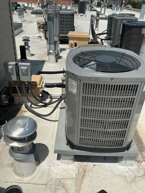 Completed spring preventive maintenance and clean and check service on rooftop commercial air conditioning system per maintenance agreement protocol. Performed comprehensive inspection of condenser unit, verified electrical connections and disconnect boxes, measured system temperatures with digital instrumentation recording -19.5°F temperature differential indicating proper refrigerant charge and cooling performance, and confirmed all mechanical components operating within manufacturer specifications.