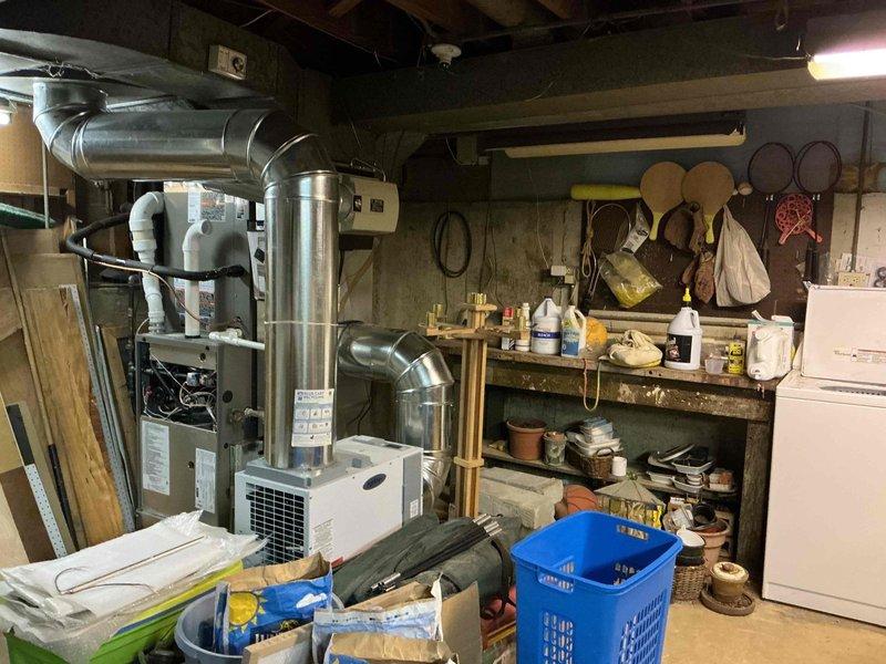 Responded to service call for thermostat error code #31 and AC not activating on unit installed two months prior. Performed system diagnostics and verified refrigerant charge levels, as customer reported inadequate cooling performance since initial installation. Inspected Goodman evaporator coil (Model CK10CT-50/60C-71, manufactured 08/2025) and associated components in basement mechanical room, documented equipment specifications and system configuration with photos for service records.