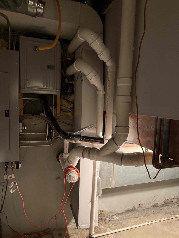 Completed HVAC installation callback to finalize remaining system components. Finished flue pipe installation, completed humidifier wiring and water line connection, verified gas connections, checked and adjusted refrigerant charge to manufacturer specifications, and programmed thermostat with WiFi connectivity setup.