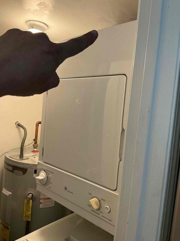 Completed annual Comfort Plan clean and check maintenance on single HVAC system. Inspected air handler and ductwork in utility area, verified system operation with supply air temperature reading of 52.3°F, and documented equipment conditions. Evaluated dryer vent accessibility for potential future cleaning service and provided assessment to customer.