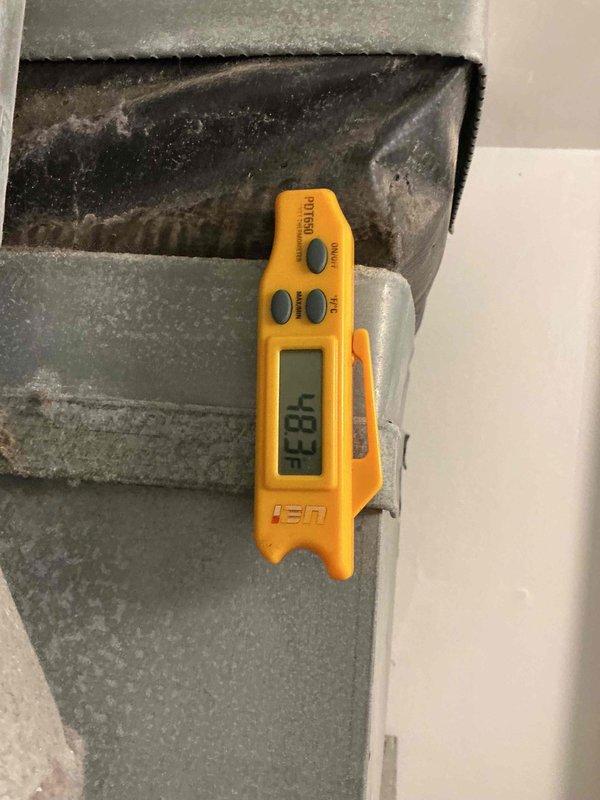 Completed annual Comfort Plan clean and check maintenance on single HVAC system. Inspected air handler and ductwork in utility area, verified system operation with supply air temperature reading of 52.3°F, and documented equipment conditions. Evaluated dryer vent accessibility for potential future cleaning service and provided assessment to customer.