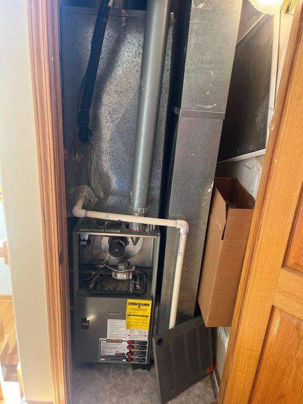 Completed estimate for replacement of second floor furnace system located in utility closet. Assessed existing gray furnace unit with front panel access, noting current configuration including blower motor assembly, vertical duct trunk line, and associated ductwork connections. Evaluated copper refrigerant lines, galvanized metal ductwork, PVC drainage piping, and condensate pump components for compatibility with replacement equipment. Documented mechanical room layout including clearance requirements, electrical service availability, and proximity to water heater. Provided comprehensive replacement options for furnace unit and discussed potential air conditioning system addition to create complete HVAC solution for second floor heating and cooling needs.