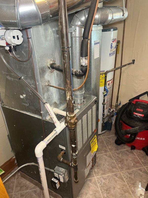 Completed estimate for replacement of second floor furnace system located in utility closet. Assessed existing gray furnace unit with front panel access, noting current configuration including blower motor assembly, vertical duct trunk line, and associated ductwork connections. Evaluated copper refrigerant lines, galvanized metal ductwork, PVC drainage piping, and condensate pump components for compatibility with replacement equipment. Documented mechanical room layout including clearance requirements, electrical service availability, and proximity to water heater. Provided comprehensive replacement options for furnace unit and discussed potential air conditioning system addition to create complete HVAC solution for second floor heating and cooling needs.