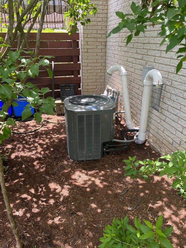 Responded to service call for 20-year-old HVAC system blowing warm air. Diagnostic evaluation revealed condenser unit approximately 4-5 lbs low on R22 refrigerant and cracked heat exchanger in furnace. Due to age of equipment, obsolete R22 refrigerant, and critical safety issue with compromised heat exchanger, provided comprehensive estimate for complete system replacement. Documented existing indoor air handler/furnace installation and outdoor condenser unit with photographic evidence. Discussed system replacement options and presented estimate to address both refrigerant loss and failed heat exchanger components.