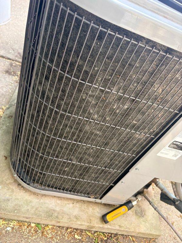 Responded to emergency no-cooling call for 3-year-old residential air conditioning system. Upon arrival, performed visual inspection of outdoor condensing unit, noting significant accumulation of dirt and debris on condenser coil fins restricting airflow. Conducted diagnostic testing using refrigerant gauges to assess system pressures and operational parameters. Condenser coil cleaning required to restore proper heat exchange and system efficiency, addressing primary cause of cooling failure.