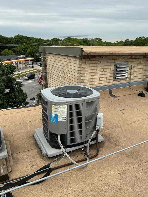 Completed scheduled comfort plan maintenance on rooftop HVAC air conditioning system. Performed comprehensive clean and check inspection including electrical connections at breaker panel, verified proper operation of all components, and documented equipment condition with photos. Unit operating within normal parameters with no issues identified during service visit.