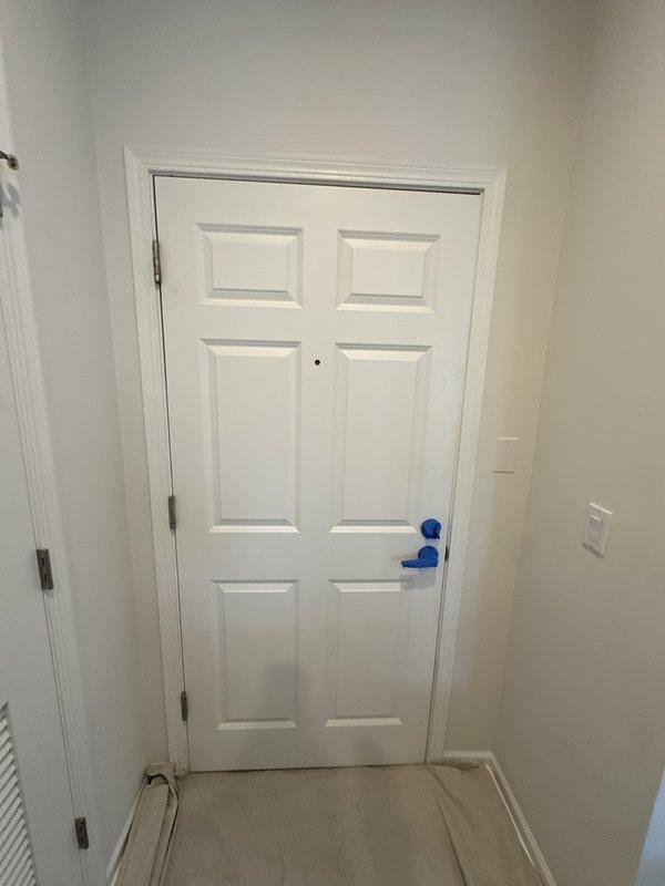 Completed post-installation callback to address door damage caused during original HVAC system installation. Documented entry door condition with photographs and confirmed commitment to repaint affected areas. Attempted to obtain air handler serial number photograph for equipment registration purposes but was unable to capture due to access limitations at time of visit.