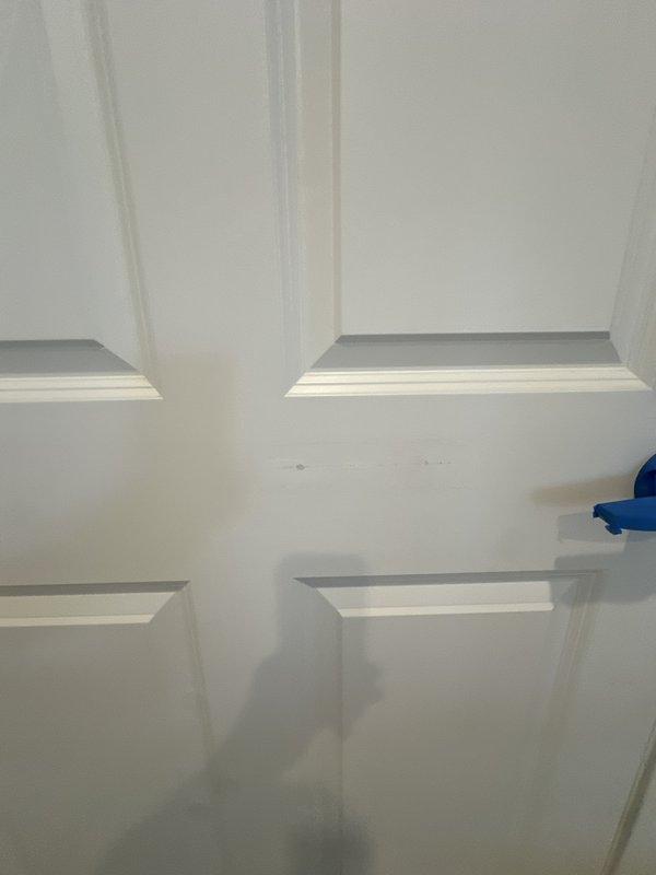 Completed post-installation callback to address door damage caused during original HVAC system installation. Documented entry door condition with photographs and confirmed commitment to repaint affected areas. Attempted to obtain air handler serial number photograph for equipment registration purposes but was unable to capture due to access limitations at time of visit.