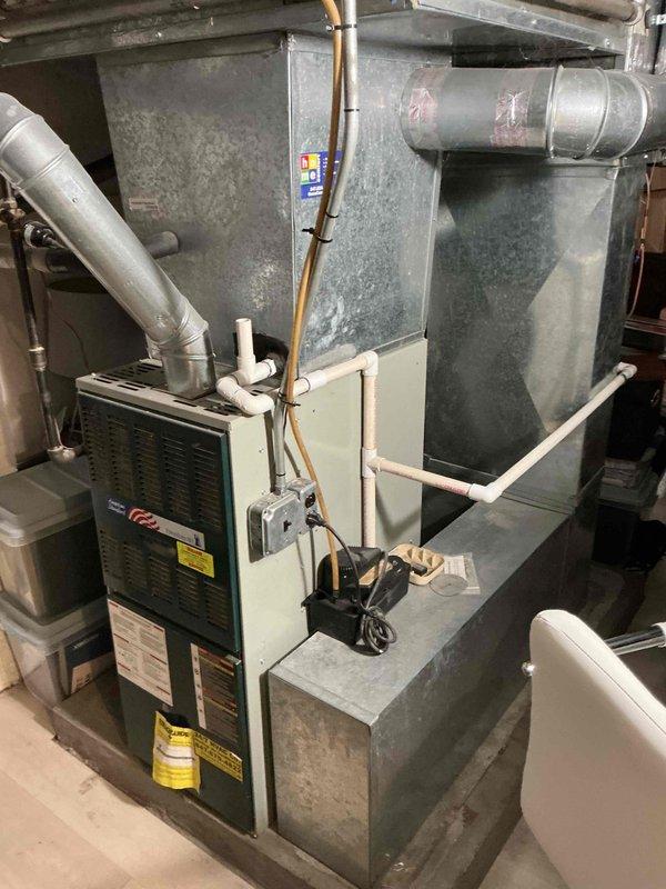 Completed comprehensive Clean and Check maintenance service on residential forced-air cooling system as part of Silver Comfort Plan membership. Performed thorough inspection of furnace, air handler, ductwork, refrigerant lines, electrical connections, and condensate drain system. Verified proper operation of all HVAC components, checked air filter condition, and documented equipment specifications and current system status with photographic records.