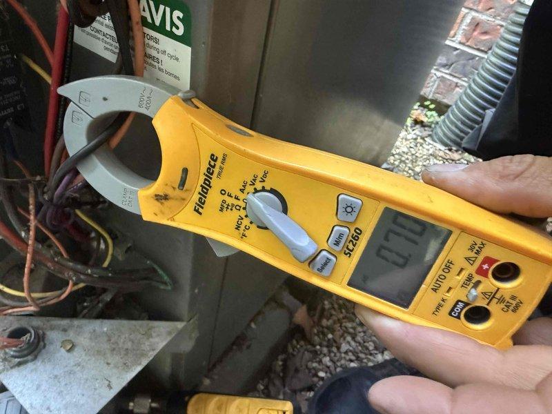 Completed Comfort Plan maintenance on single-system air conditioning unit. Performed comprehensive clean and check procedures including electrical diagnostics with clamp meter to verify proper amperage draw and system performance. Inspected and serviced outdoor condensing unit, checked refrigerant line insulation integrity, verified all electrical connections, and ensured proper airflow through ventilation components. System operating within normal parameters with no deficiencies noted.