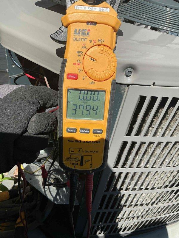 Completed spring maintenance clean and check on residential air conditioning system per comfort plan agreement. Performed comprehensive inspection of outdoor condenser unit, verified proper electrical operation with amp draw readings of 1.007A and 37.94A at compressor, cleaned condenser coil and housing, checked refrigerant levels, and confirmed unit operational parameters within manufacturer specifications.