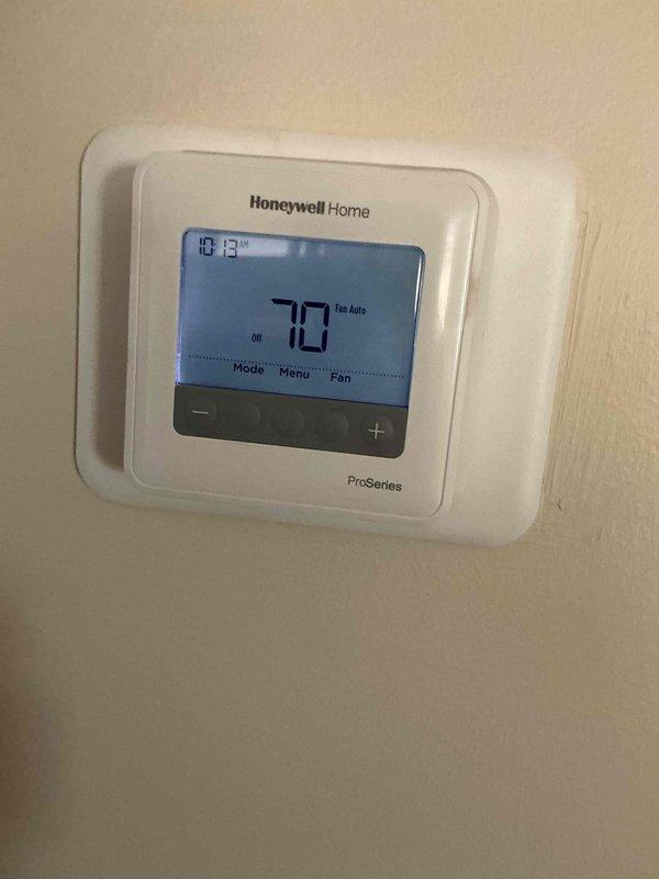 Completed preventive maintenance clean and check on two air conditioning systems per comfort plan agreement. Both units were found to be one pound low on refrigerant and were recharged to manufacturer specifications. Documented low refrigerant charge for monitoring during next spring's maintenance visit, with recommendation to schedule service in June or when ambient temperatures exceed 65 degrees to allow proper system assessment. Advised that if refrigerant loss reoccurs, further leak detection and system evaluation will be necessary to determine viability of repair versus replacement. Customer reported noise concerns with recently installed furnace but later determined likely cause to be birds in vicinity rather than mechanical issue. Customer requested thermostat switch replacement; advised that scope of work is limited to simple switch replacement and any additional electrical modifications would require licensed electrician. Photographed both thermostat units showing operational 