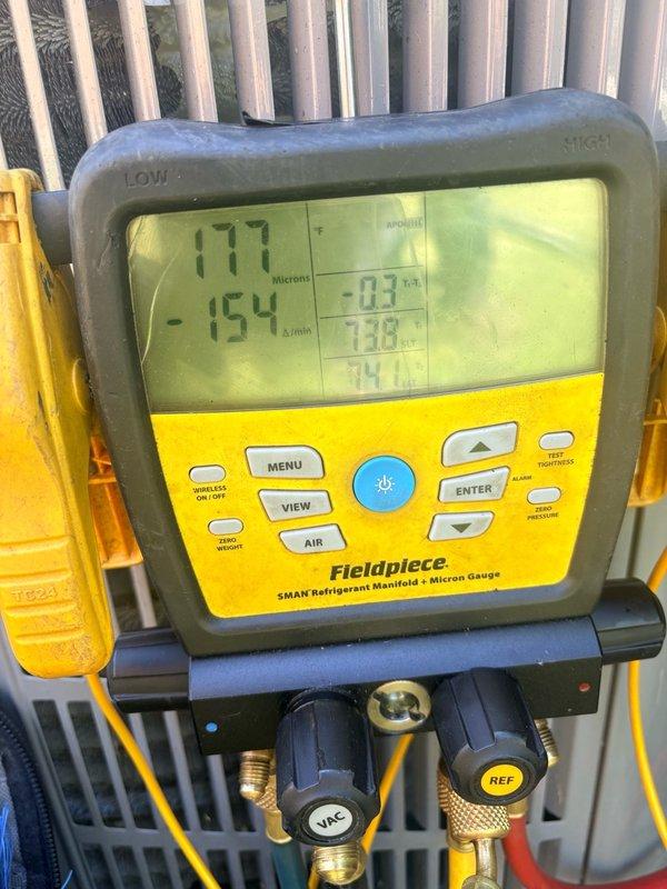 Completed warranty replacement of leaking evaporator coil on Unico system air handler located in attic space. Removed defective coil, installed replacement unit, reconnected refrigerant lines and condensate drainage, evacuated system, and charged to manufacturer specifications using digital manifold gauges to verify proper pressures and system operation.
