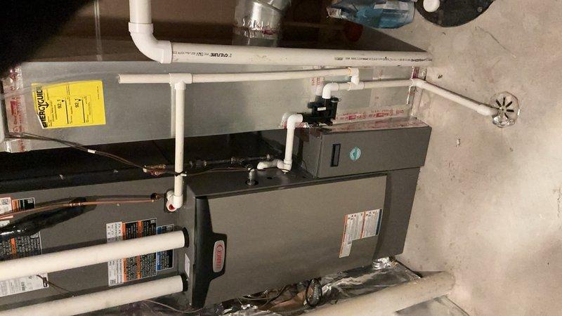 Completed full HVAC system replacement installing new Lennox SLP99V variable-capacity gas furnace and EL18XCV air conditioning unit with new media filter cabinet. Integrated equipment with existing thermostat controls and zone panel system, ensuring proper communication and functionality across all zones. All condensate drainage and venting installed per manufacturer specifications, system tested and verified operational.
