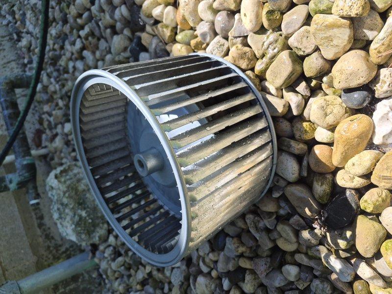 Performed comprehensive evaporator coil and blower wheel cleaning on residential HVAC system. Removed heavily soiled squirrel cage blower assembly showing significant dirt accumulation and discoloration across fins and blades. Cleaned evaporator coil unit with multiple rows of aluminum fins that had accumulated dust and debris, affecting system efficiency. Both components were thoroughly cleaned and reinstalled to restore proper airflow and heat transfer capacity.
