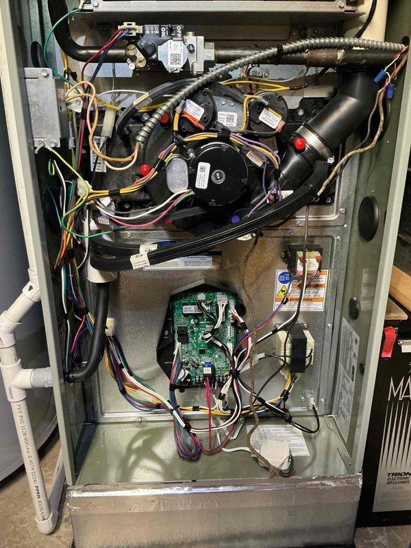 Completed annual Comfort Plan clean and check service on American Standard air conditioning system. Performed comprehensive inspection of outdoor condenser unit and indoor air handler, verifying all electrical connections, capacitors, and control board operation. System tested and operating within normal parameters with all components functioning properly.