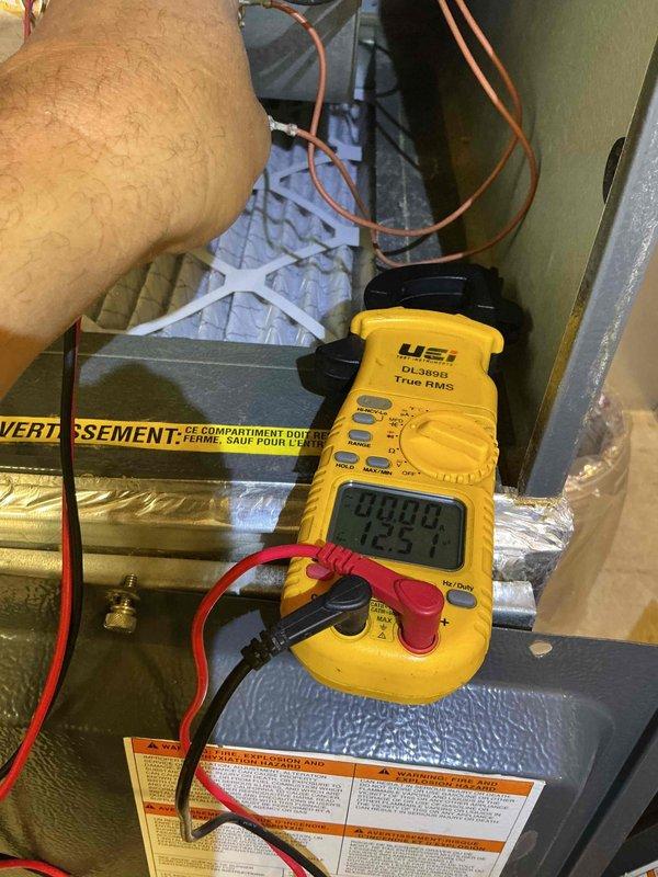 Completed scheduled preventive maintenance clean and check on residential split system air conditioning unit per comfort plan agreement. Performed comprehensive inspection of outdoor condensing unit including visual assessment of cabinet condition, refrigerant line connections, and electrical disconnect. Utilized digital clamp meter to verify proper amperage draw and electrical performance at indoor air handler. Inspected refrigerant lines, ductwork connections, and system components in mechanical space to ensure proper operation and identify any potential service needs.