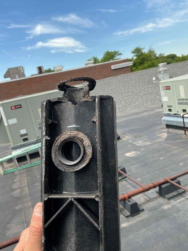 Replaced failed drain pan in rooftop unit RTU5 located on lower level rooftop. Removed damaged component, installed new coil pan, and verified proper drainage function. Collected outstanding balance for completed repair work.